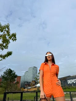 Glamorous Jet Setter|Chic Escapes|Orange Checkerboard Button Through Romper -